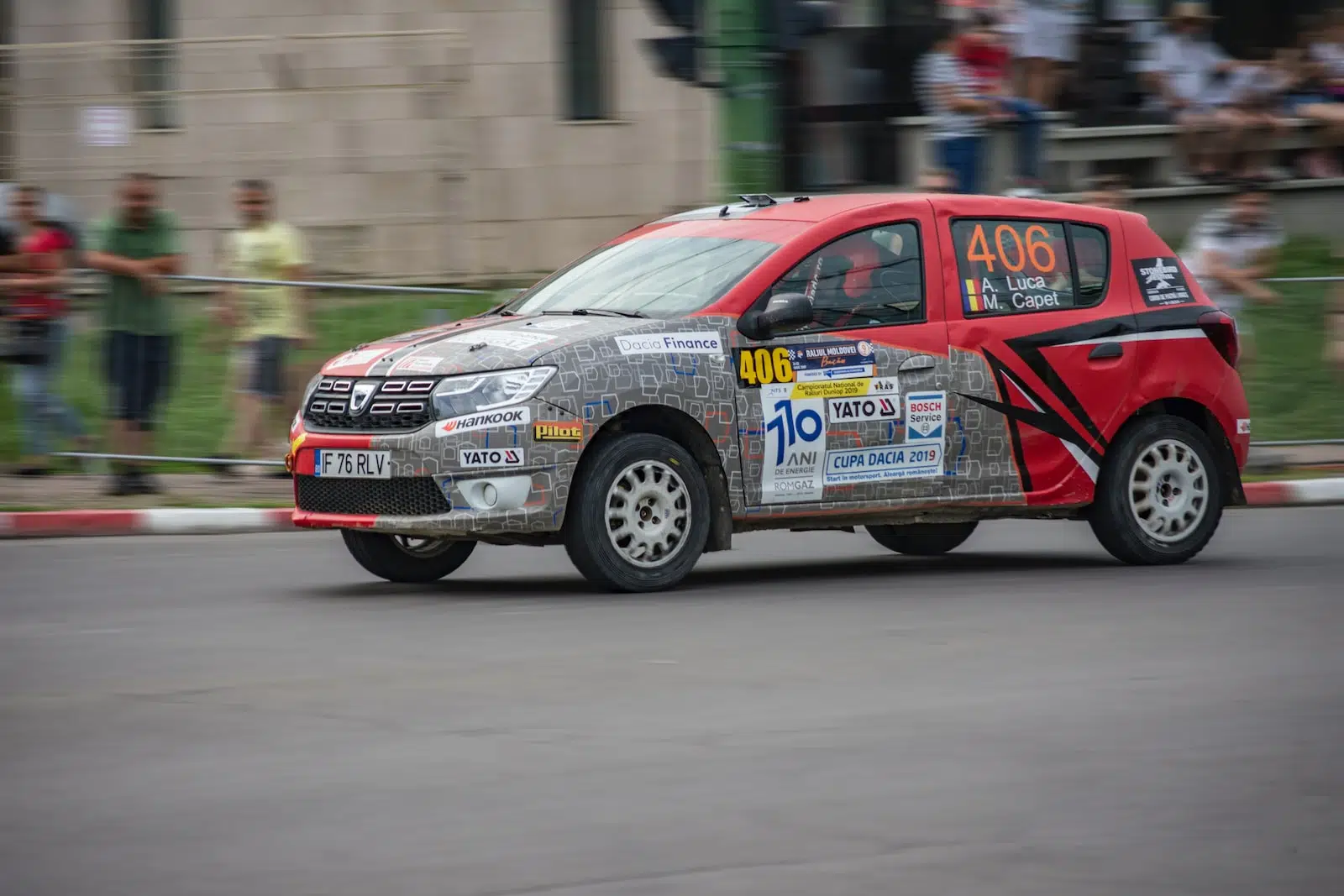 red and blue honda sedan on road during daytime